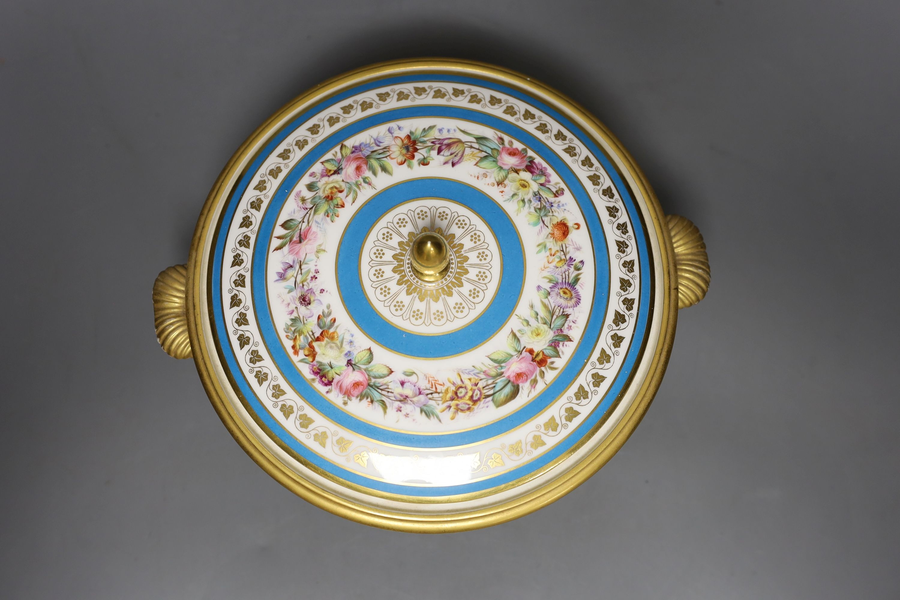 Sevres ecuelle and cover painted with a band of flowers surrounding the gilt monogram of Louis Phillipe, blue mark dated 1850, red mark for Chateau de Compiegne 25cm